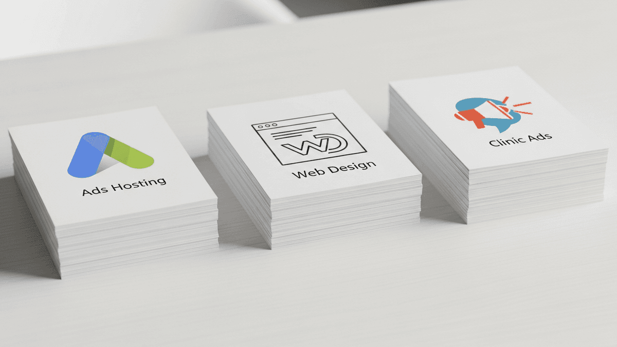 Separate invoice stacks for advertising hosting and design on clinic desk