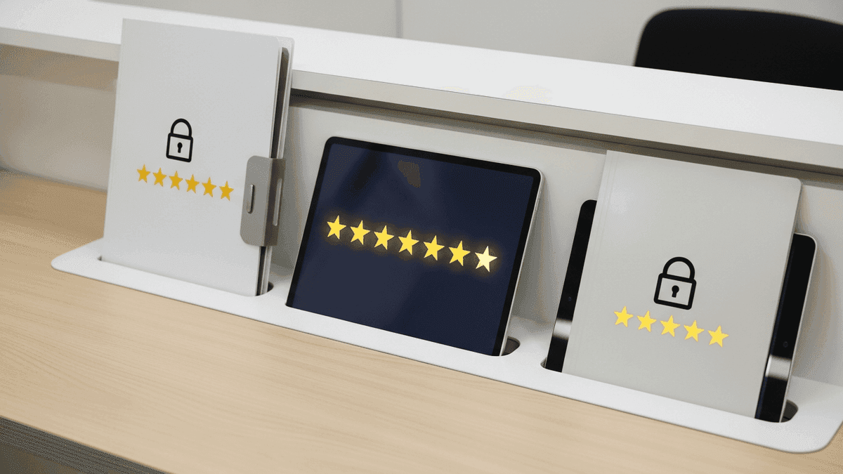 Tablet with review stars and lock icons beside compliance folder on a podiatry reception desk